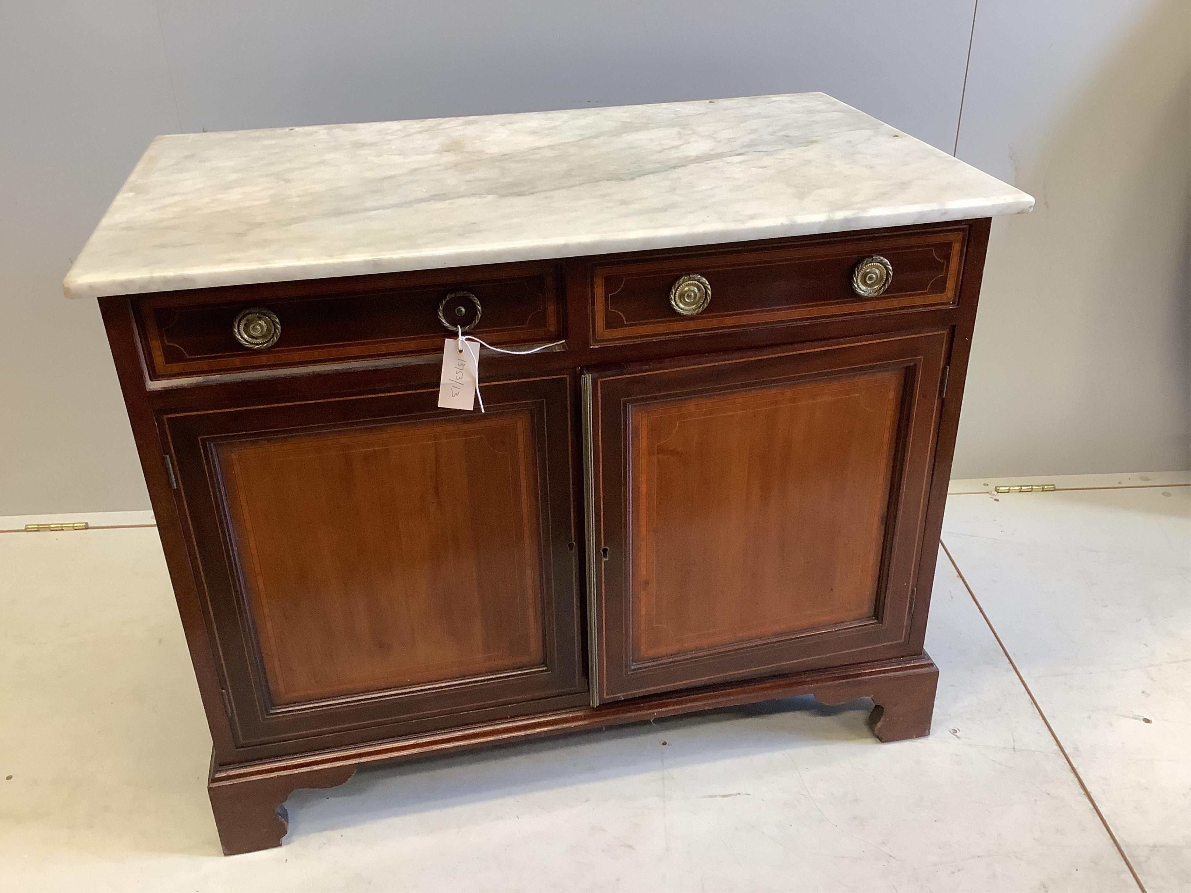 An Edwardian satinwood banded and inlaid mahogany two door side cabinet, fitted two frieze drawers and a white marble top on bracket feet, width 92cm, depth 54cm, height 75cm
